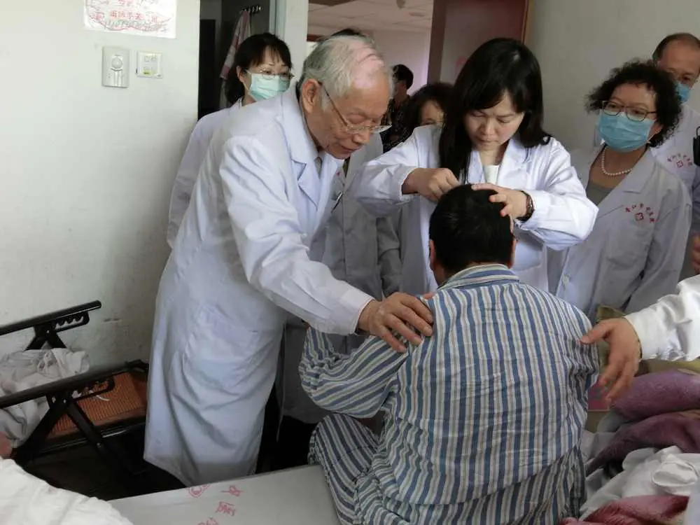 Professor Ming Qing Zhu leading a bedside teaching demonstration for Zhu's Scalp Acupuncture (ZSA), 2013.
