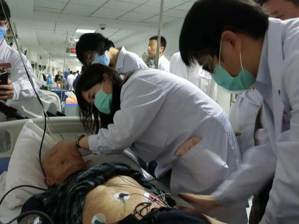 Dr. Shy and Dr. Sheng Chun Chang with Professor Ming Qing Zhu during a Zhu’s Scalp Acupuncture (ZSA) emergency clinical teaching demonstration in 2017.