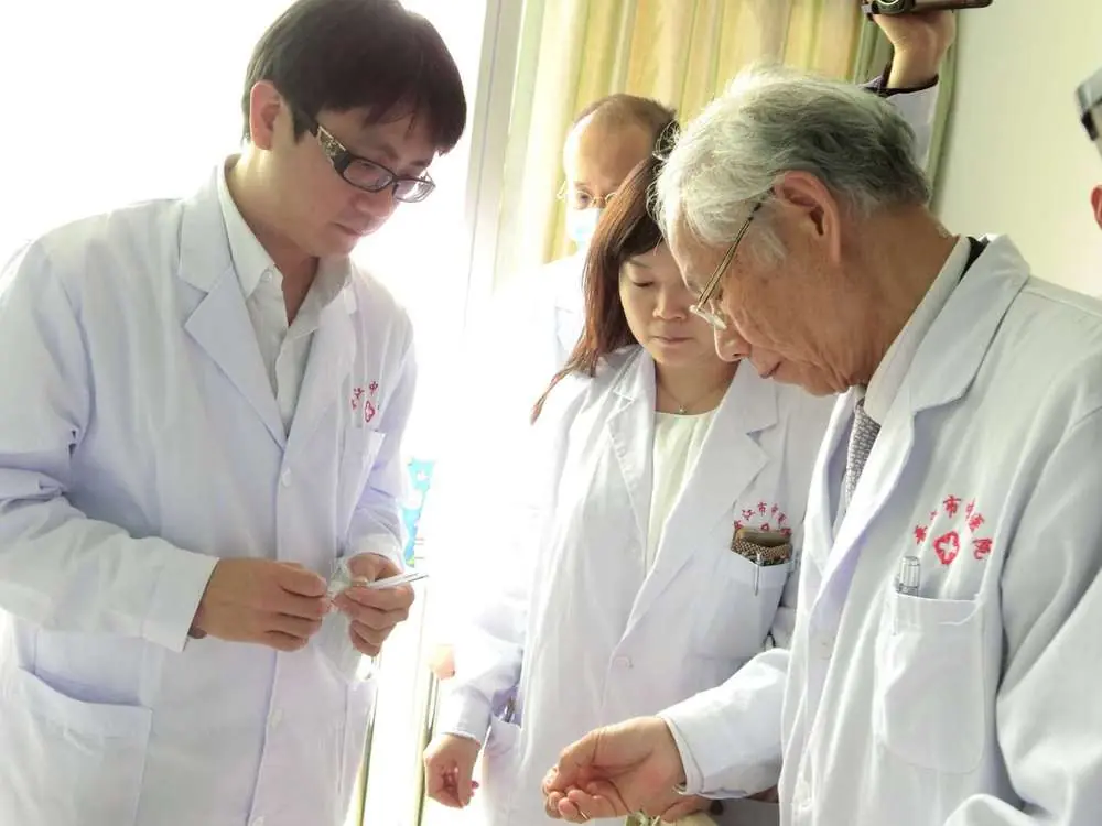 Dr. Shy and Dr. Chang with Professor Ming Qing Zhu during clinical training for Zhu's Scalp Acupuncture (ZSA)